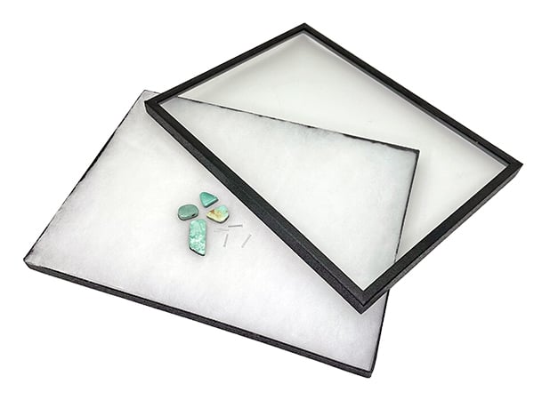 Glass topped Riker Cases displaying collectibles in five sizes